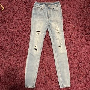 Woman’s  ripped blue jeans